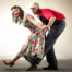 Couple dancing different types of swing dance styles