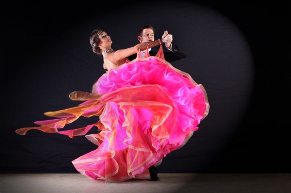 A couple in a waltz dance style pose.