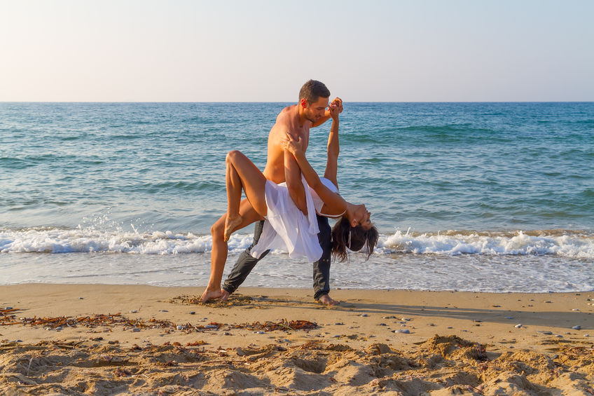 Dancing couple at the beach