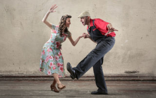 Couple taking swing dance lessons
