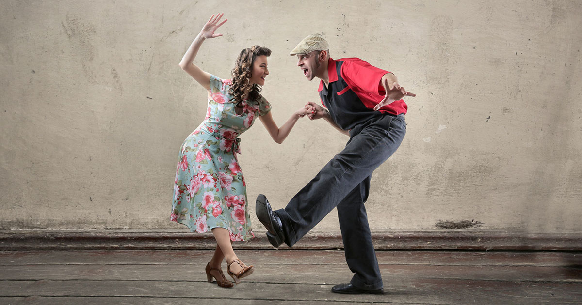 Couple taking swing dance lessons